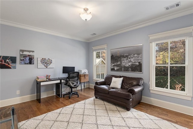 home office featuring hardwood / wood-style floors and crown molding