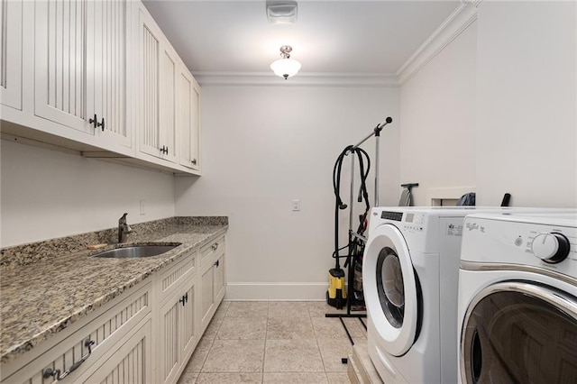 washroom with sink, cabinets, separate washer and dryer, crown molding, and light tile patterned flooring