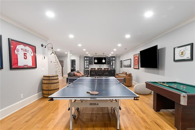 recreation room featuring light hardwood / wood-style flooring, bar, crown molding, and pool table