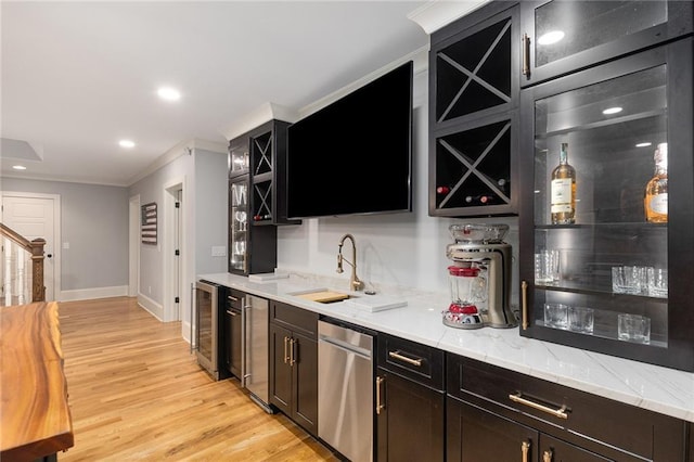 bar with dishwasher, crown molding, wine cooler, light stone countertops, and light hardwood / wood-style floors