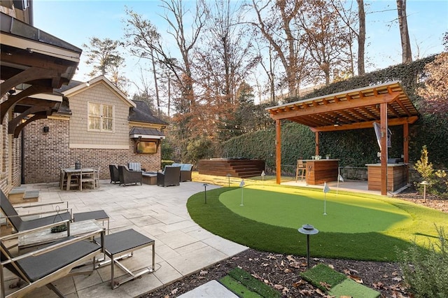 view of patio featuring outdoor lounge area and an outdoor kitchen