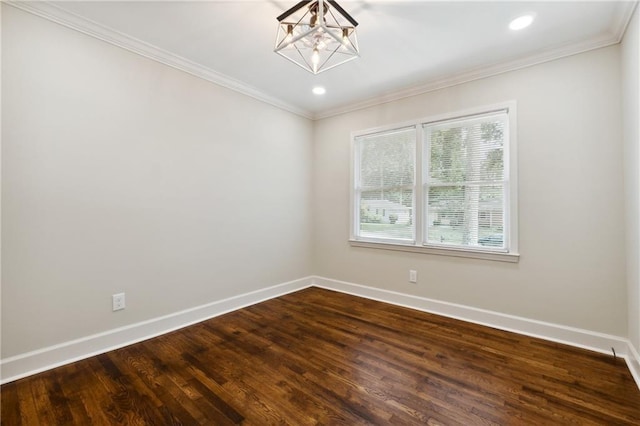 unfurnished room with a chandelier, hardwood / wood-style floors, and crown molding