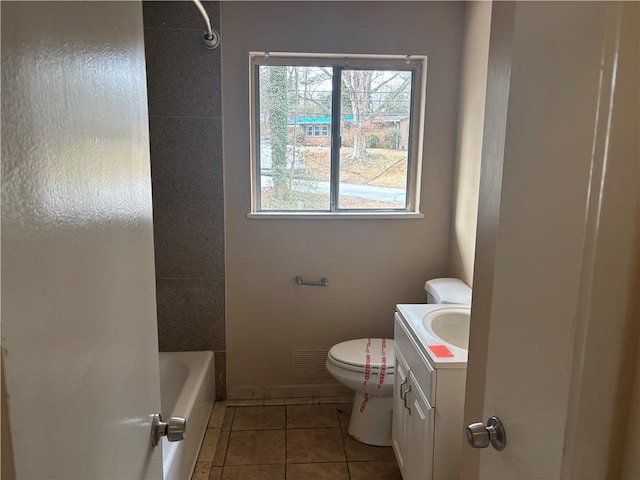 bathroom featuring toilet, tile patterned flooring, and vanity