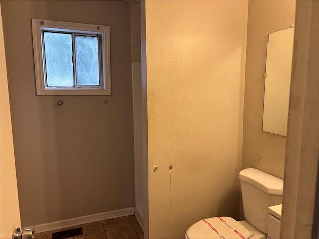 bathroom featuring toilet and tile patterned floors