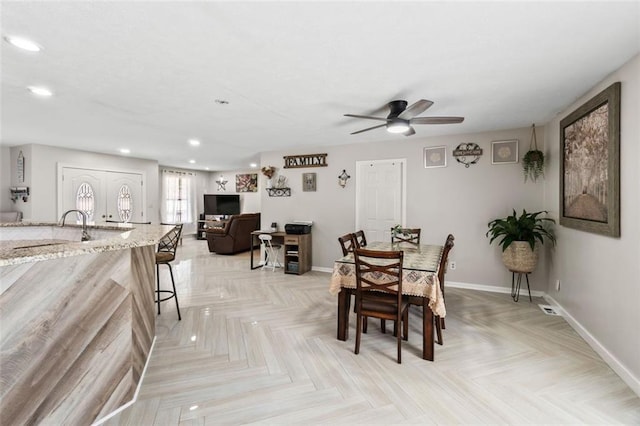 dining area with recessed lighting, a ceiling fan, and baseboards