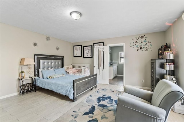 bedroom with baseboards and wood finished floors