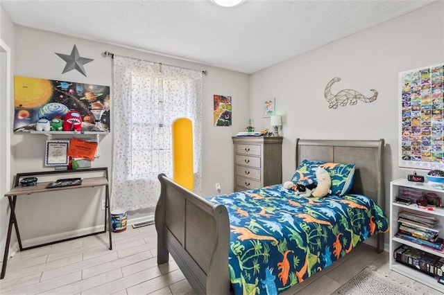 bedroom with wood finished floors