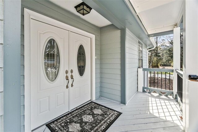 entrance to property with a porch