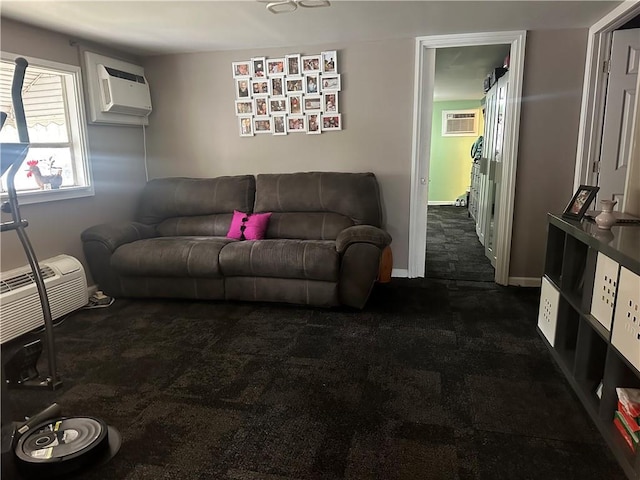 living area featuring baseboards, an AC wall unit, and carpet
