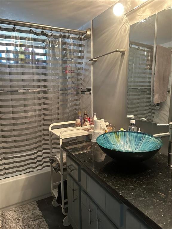 bathroom with tile patterned floors, vanity, and shower / bath combo