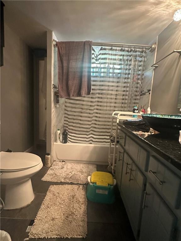 full bathroom with toilet, tile patterned floors, and vanity