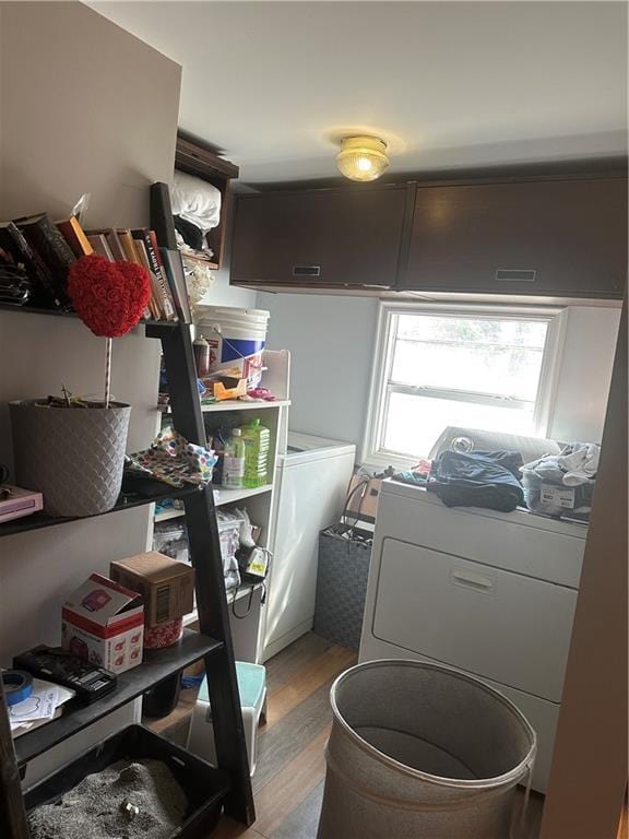 laundry room with cabinet space and light wood finished floors