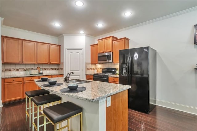 30 Lismore Way, Newnan, GA 30263 - kitchen with black appliances, a sink, light stone countertops, ornamental molding, and decorative backsplash