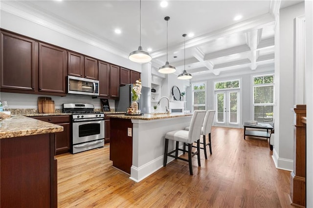 kitchen featuring stainless steel appliances, recessed lighting, crown molding, a kitchen bar, and beam ceiling