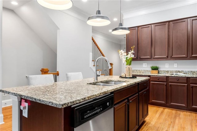 kitchen with a sink, dishwasher, light wood-style flooring, crown molding, and a kitchen island with sink