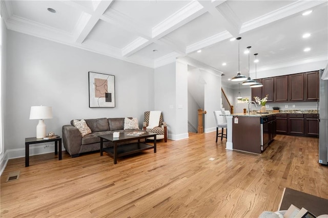 living area featuring light wood-type flooring, beam ceiling, baseboards, recessed lighting, and coffered ceiling