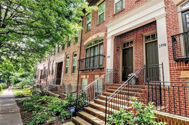 entrance to property with brick siding