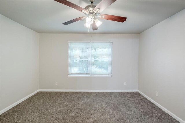 3735 Boulder Park Dr SW, Atlanta, GA 30331 - empty room featuring carpet, baseboards, and a ceiling fan