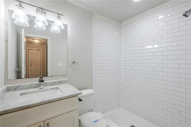 3735 Boulder Park Dr SW, Atlanta, GA 30331 - bathroom with tiled shower, vanity, and toilet