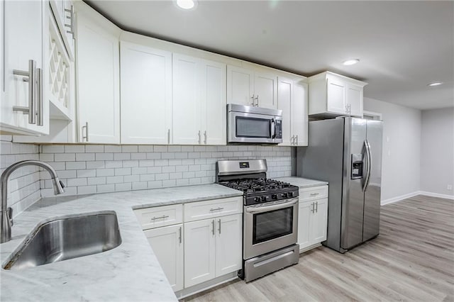 3735 Boulder Park Dr SW, Atlanta, GA 30331 - kitchen with stainless steel appliances, a sink, white cabinetry, baseboards, and recessed lighting