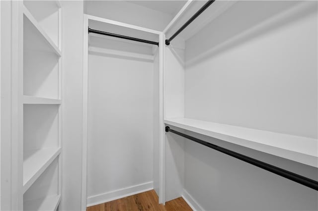 spacious closet featuring wood finished floors