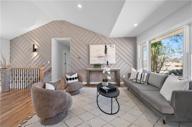 living area with lofted ceiling, wood finished floors, and recessed lighting