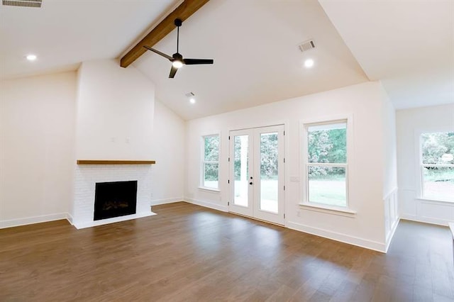 unfurnished living room with beam ceiling, ceiling fan, high vaulted ceiling, dark hardwood / wood-style floors, and a fireplace