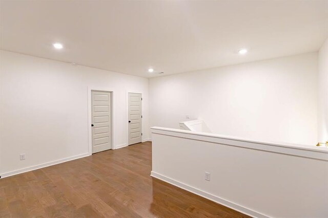 unfurnished room featuring hardwood / wood-style flooring