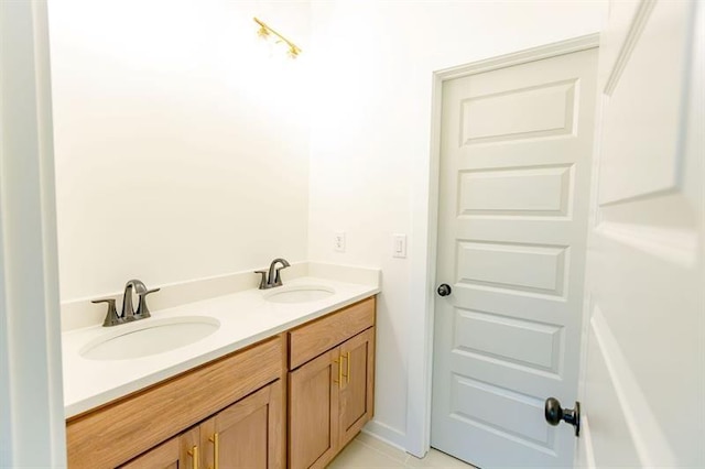 bathroom featuring tile patterned flooring and vanity