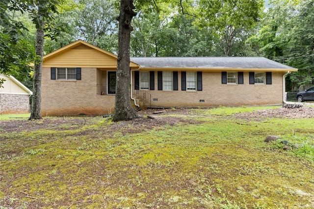 574 Horseshoe Cir SW, Lilburn, GA 30047 - ranch-style home featuring crawl space, brick siding, a front lawn, and view of scattered trees