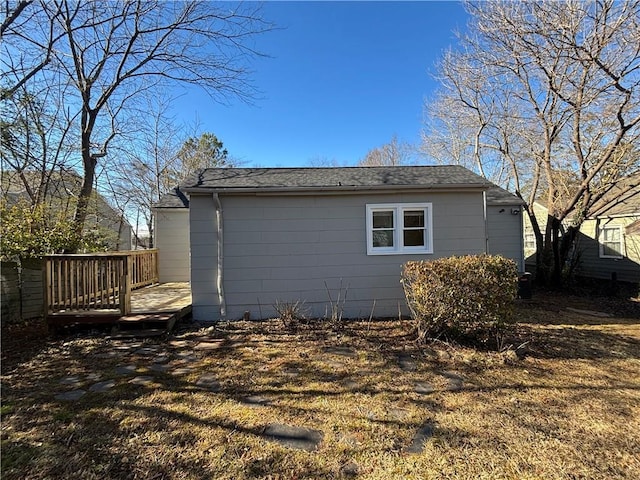 view of side of property with a deck