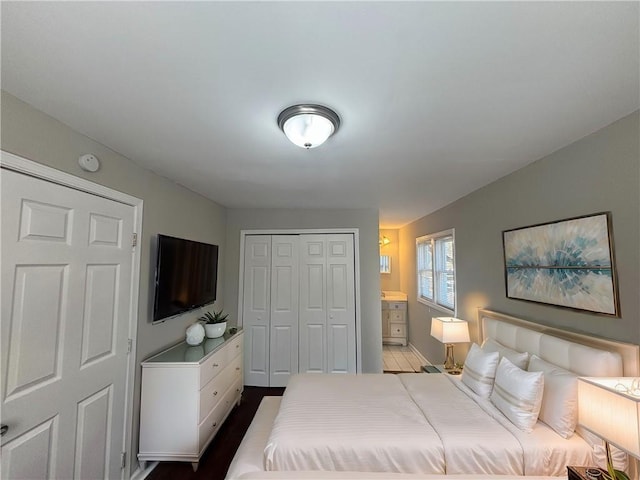 bedroom featuring connected bathroom and a closet