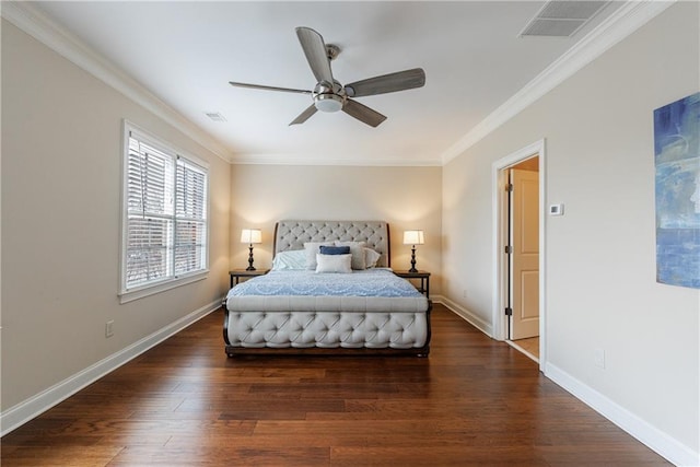 bedroom with visible vents, ornamental molding, baseboards, and wood finished floors