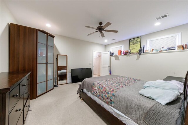bedroom with recessed lighting, visible vents, and light carpet