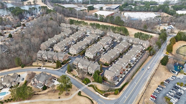 drone / aerial view with a residential view and a water view