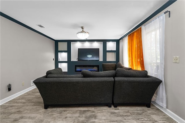 living room with ornamental molding