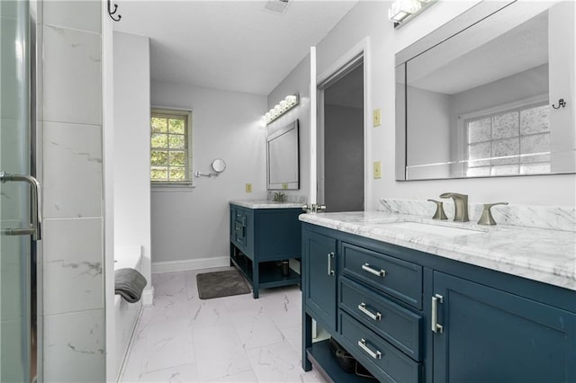 bathroom with vanity and separate shower and tub