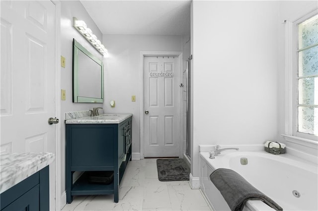 bathroom featuring vanity and a bathing tub