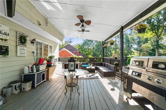 wooden terrace featuring ceiling fan, area for grilling, and an outdoor living space