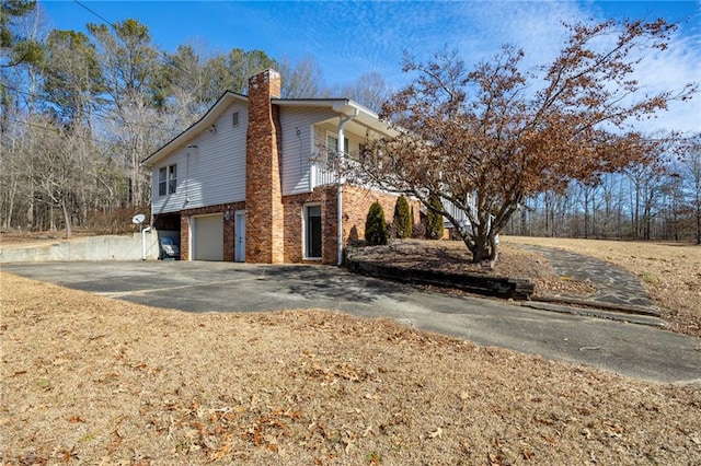 view of side of home with a garage