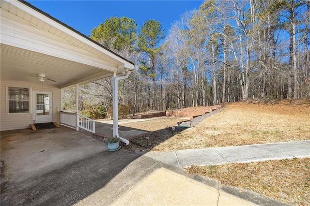 view of yard with ceiling fan