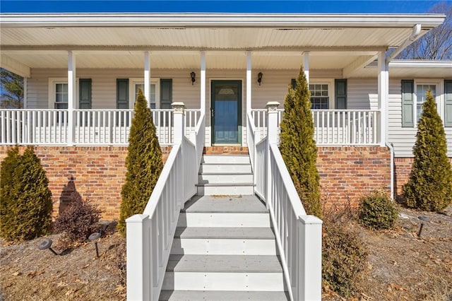 doorway to property featuring covered porch