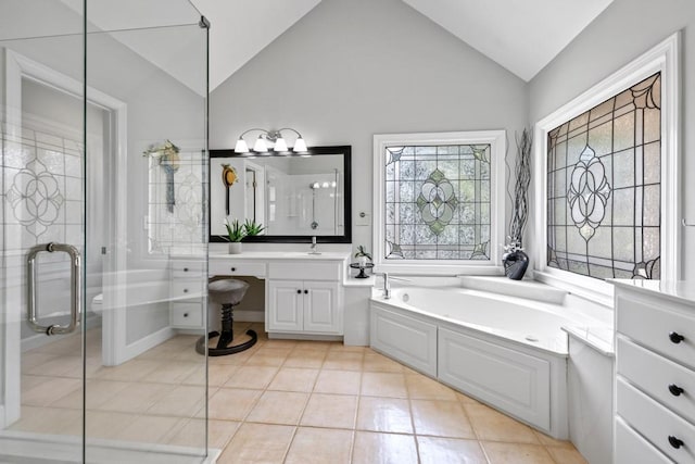 bathroom with vanity, tile patterned flooring, lofted ceiling, and separate shower and tub