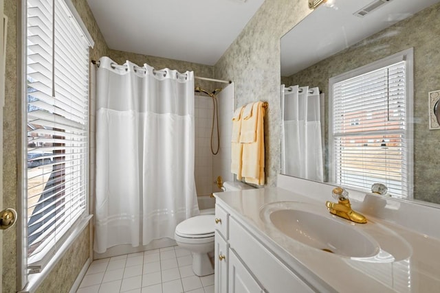 full bathroom featuring tile patterned flooring, vanity, toilet, and shower / tub combo with curtain