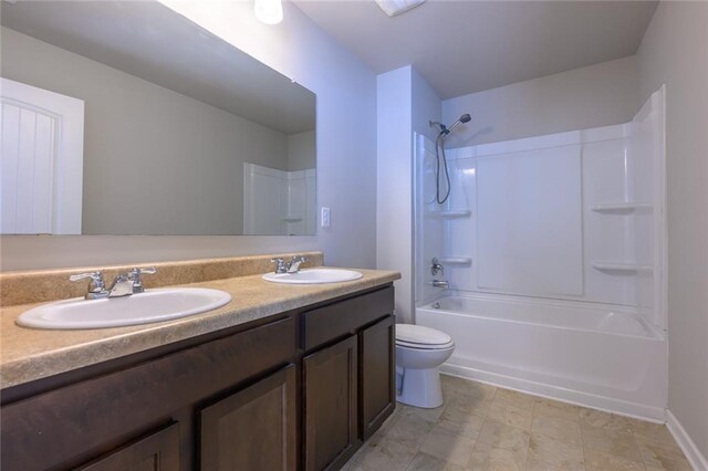 full bathroom featuring vanity, toilet, and bathing tub / shower combination