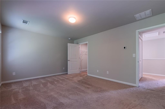 unfurnished room with light colored carpet