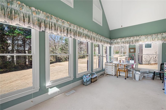 sunroom / solarium with lofted ceiling and visible vents