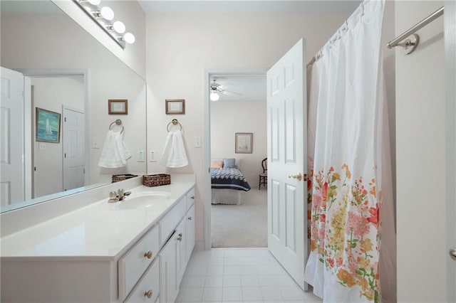 ensuite bathroom with a shower with curtain, ensuite bath, vanity, and tile patterned floors