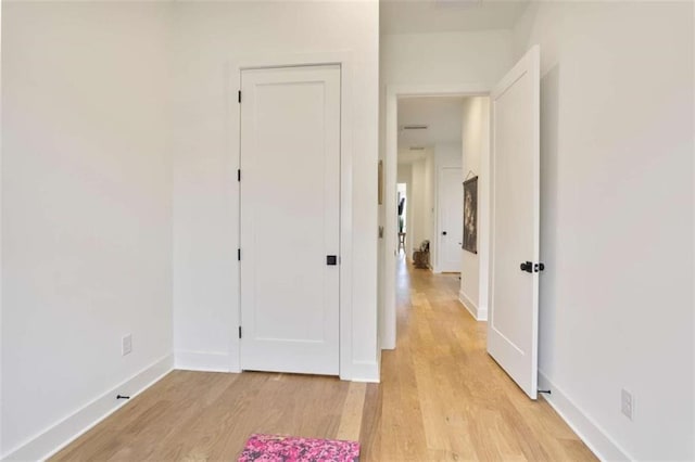 corridor featuring light wood-type flooring