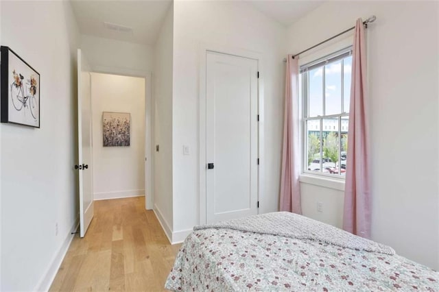 bedroom with light hardwood / wood-style flooring